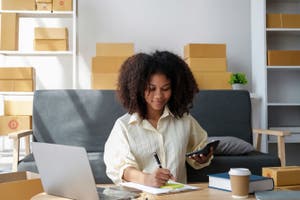 Business woman looking and trying to understand the DMCC bill that is introduced in the UK at her home office.
