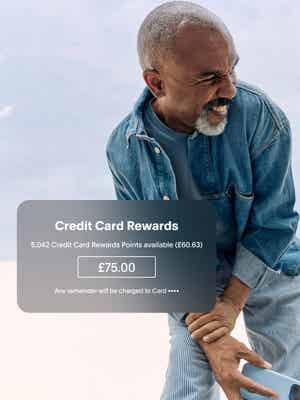 Man wearing denim smiling with cash back offer overlay